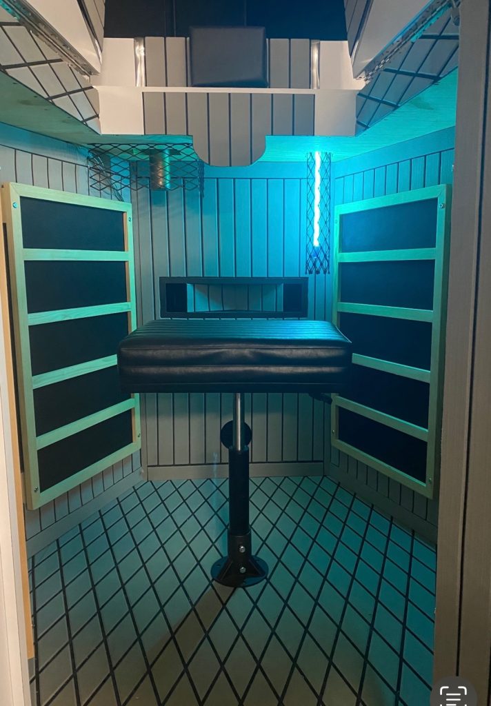 UVC self-cleaning blue light inside booth